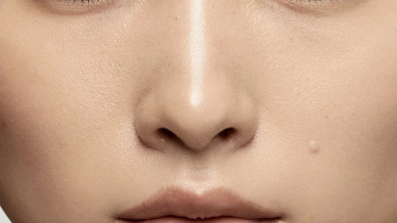 Pores examined under magnification during a skin assessment