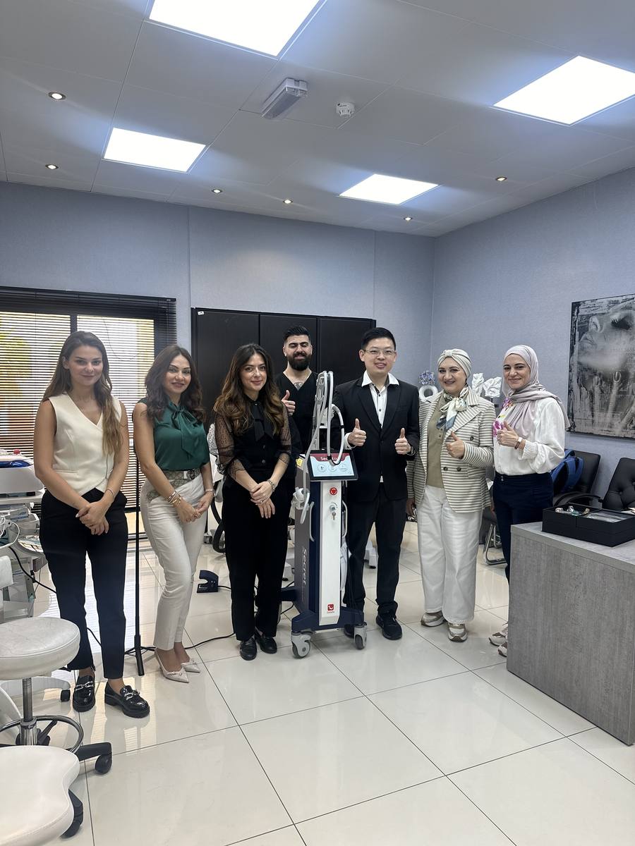 Dr Sin Yong group photo with attending physicians at Dubai clinic during ilooda KOL training — Secret RF device visible